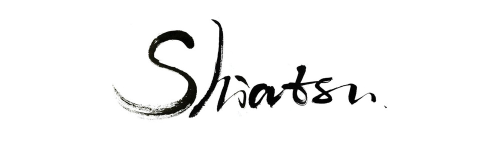 parola shiatsu in nero su sfondo bianco